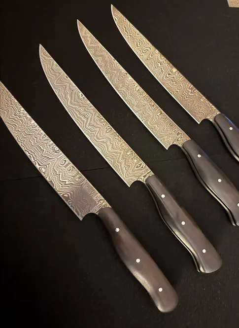 Curran Blades African Blackwood Damascus porcování 7"